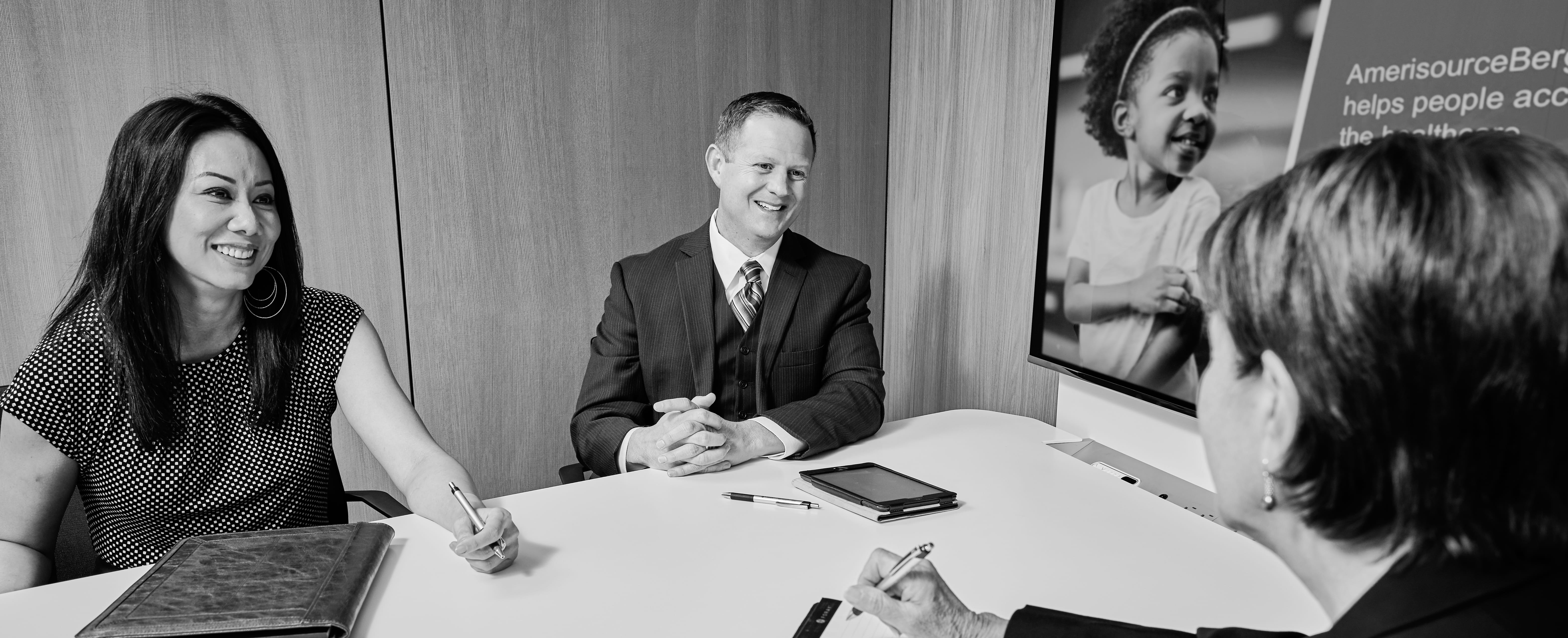 Associates meeting in a conference room