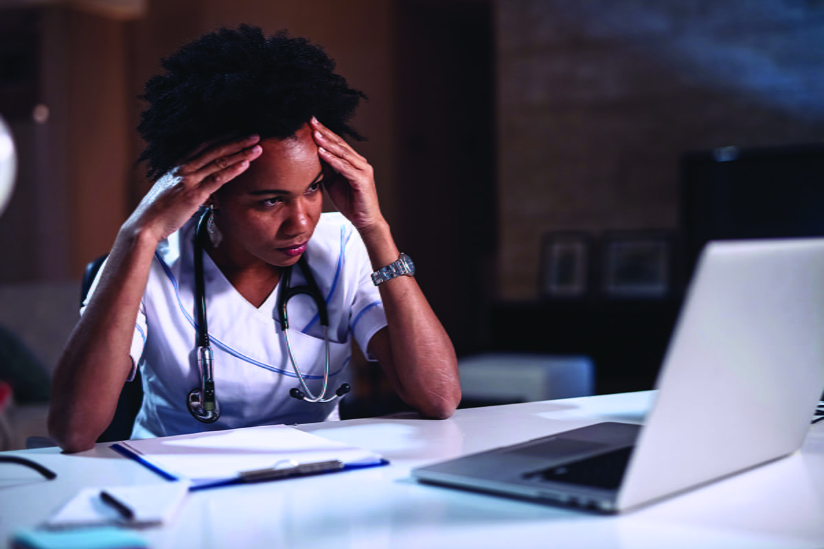 Frustrated veterinarian at a computer