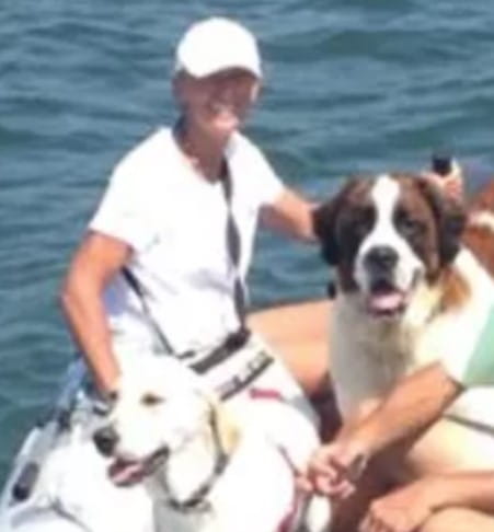 Julie Zitz on boat with dogs